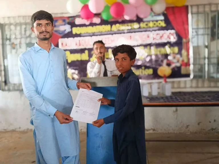 Student receiving his result from a teacher