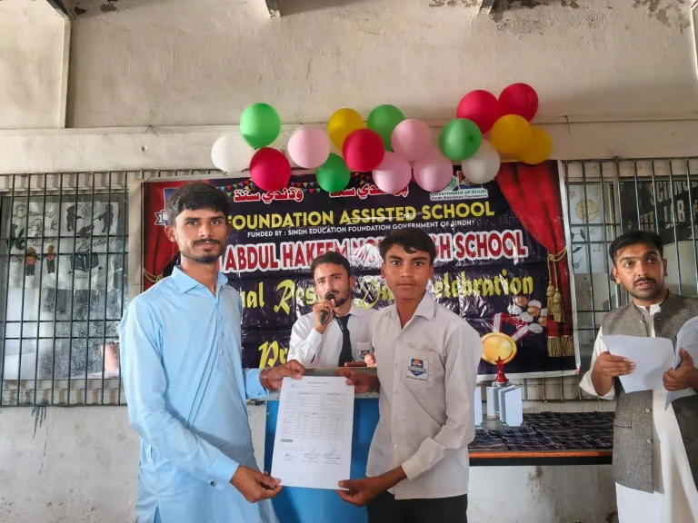 Student being handed his result at the ceremony