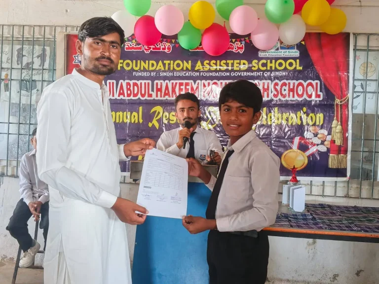 Student receiving his result at the ceremony