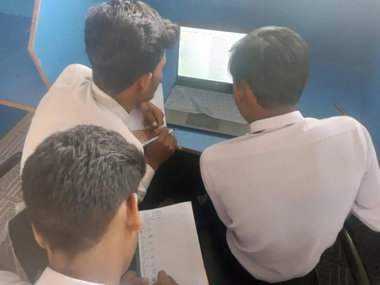 Class 10 boys taking a digital chemistry MCQ test in the computer lab