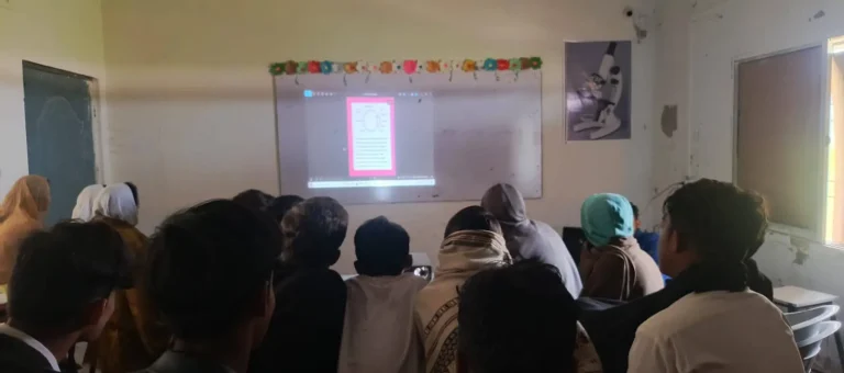 Students watching a projected lesson comparing the human eye and a camera