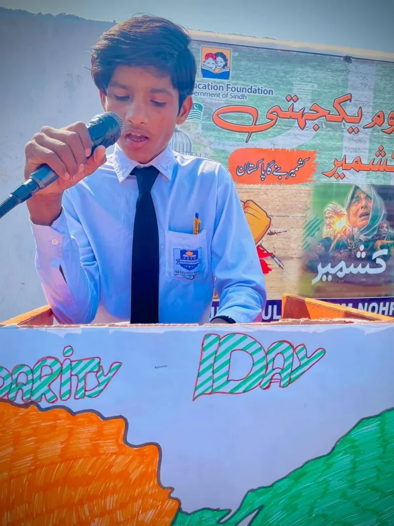 Young student speaking at the podium on 5 February