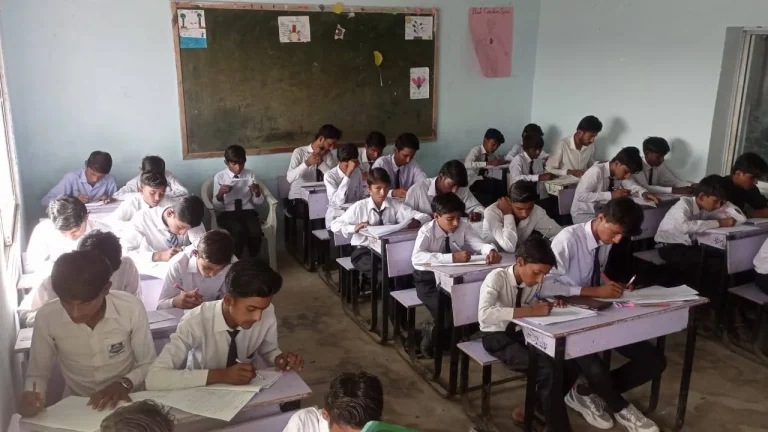 Classroom full of students sitting the 2025 midterm examinations