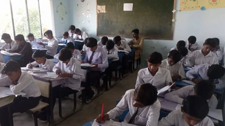 Students concentrating on their midterm examination papers