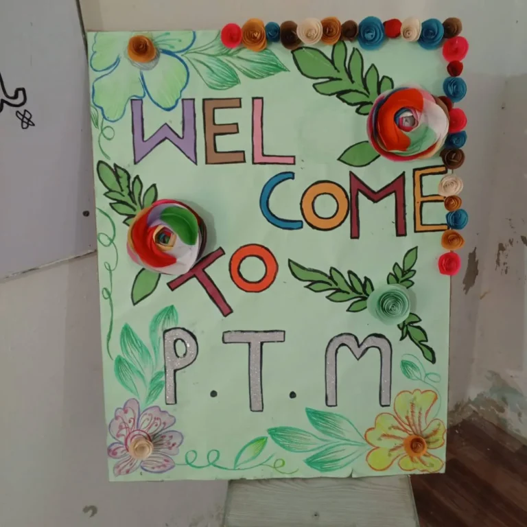 Hand-decorated Welcome to P.T.M poster made with paper flowers