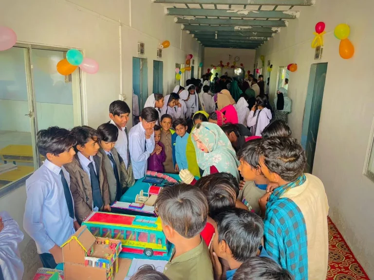 Corridor filled with students, parents and visitors at the exhibition