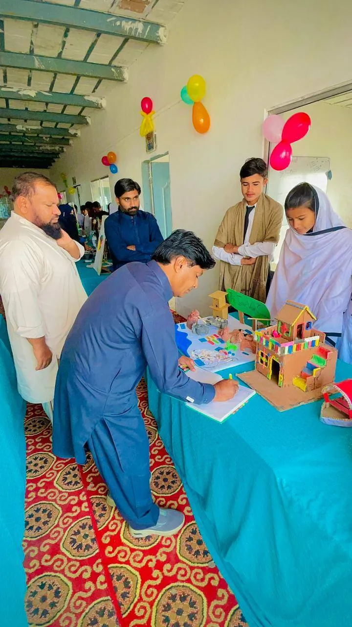 Visitors viewing student projects at the Science and Arts Exhibition